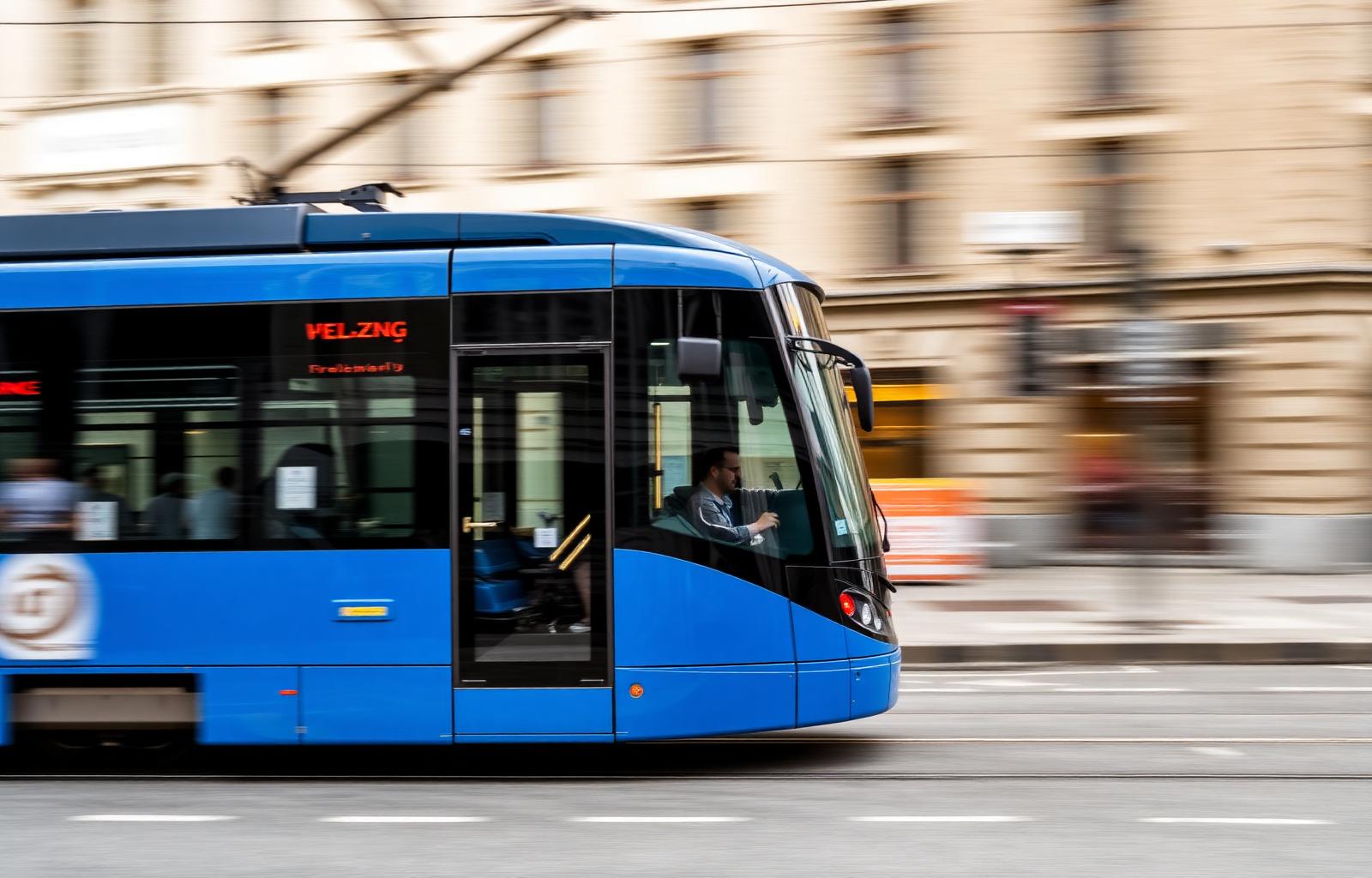 Iconic blue Zurich tram gliding through the city